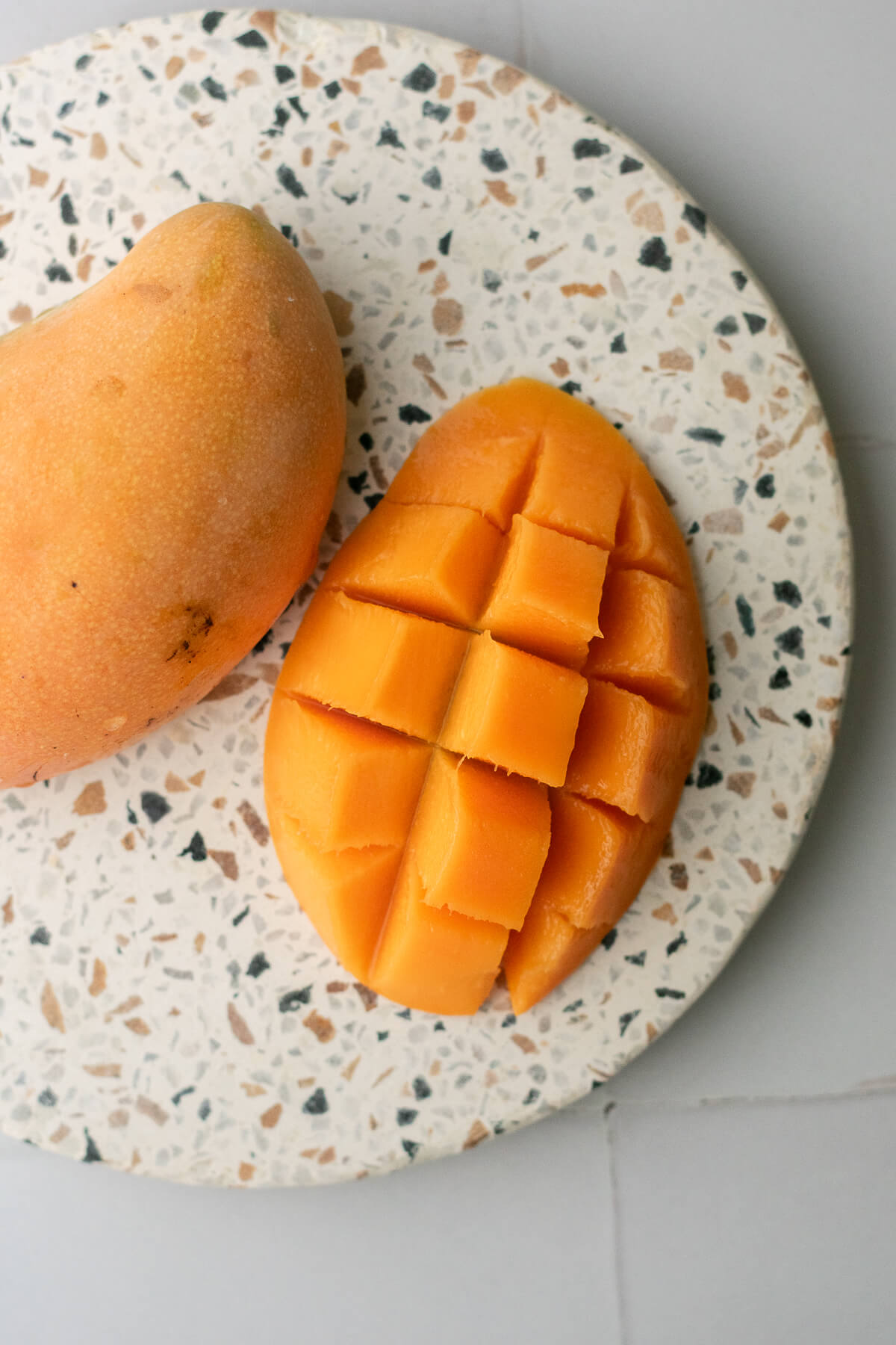 an orange-fleshed kesar mango on a plate