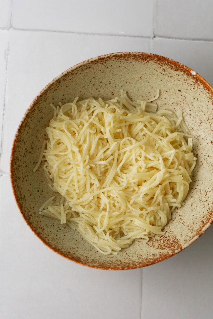 cooked vermicelli noodle strands in a bowl